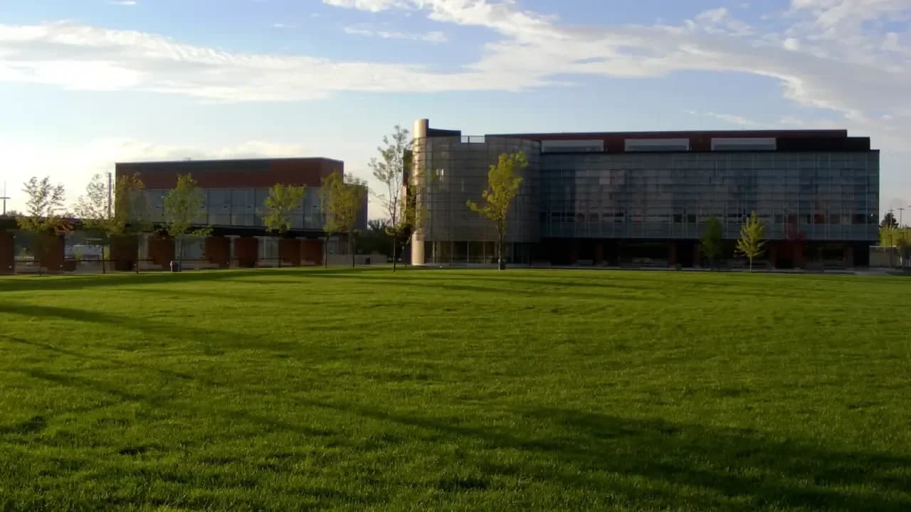 Ontario Tech University library and engineering buildings behind a wide green lawn