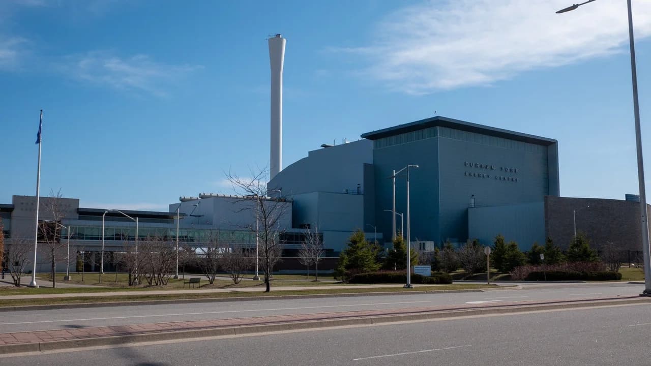 The Durham York Energy Centre building in Courtice under a blue sky; no people visible.